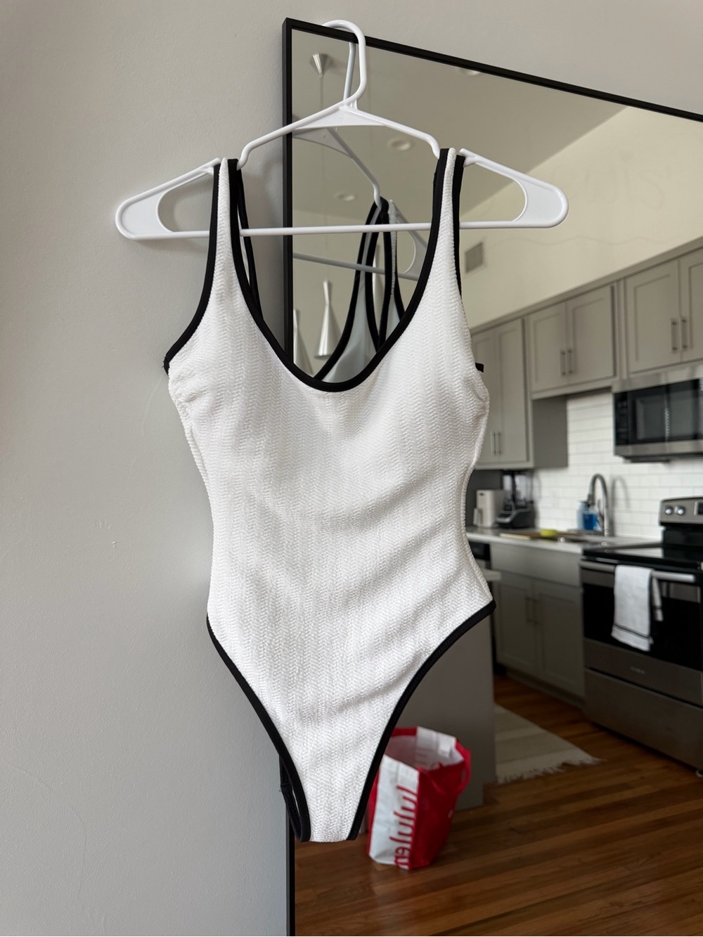 No Boundaries White One-Piece Swimsuit with Black Trim